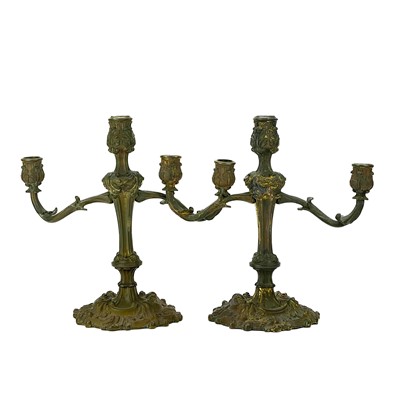 Lot 101 - A pair of rococo style ormolu candelabra.