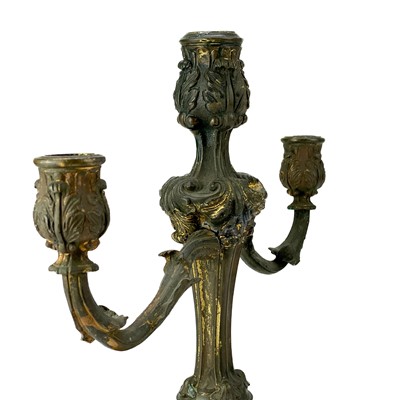 Lot 101 - A pair of rococo style ormolu candelabra.
