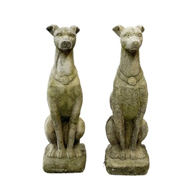 Lot 234 - A pair of reconstituted stone figures of whippets.