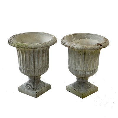 Lot 57 - A pair of reconstituted stone garden urns.