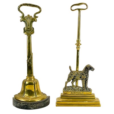 Lot 83 - A Victorian brass and cast iron door stop.