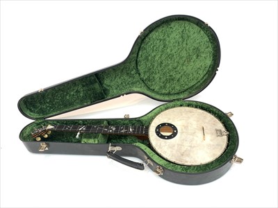 Lot 425 - A five string banjo by F C Wilkes, the...