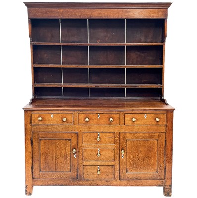 Lot 19 - An oak dresser and rack.