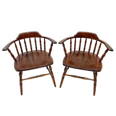 Lot 59 - A pair of beech and ash smokers bow style elbow chairs.