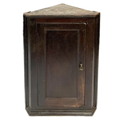 Lot 36 - A Georgian oak corner cupboard.