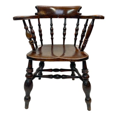 Lot 97 - A Victorian oak bow smokers chair.