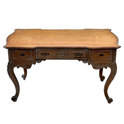 Lot 88 - A Continental oak bureau plat.