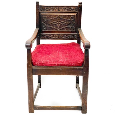 Lot 41 - A late Victorian oak hall arm chair.