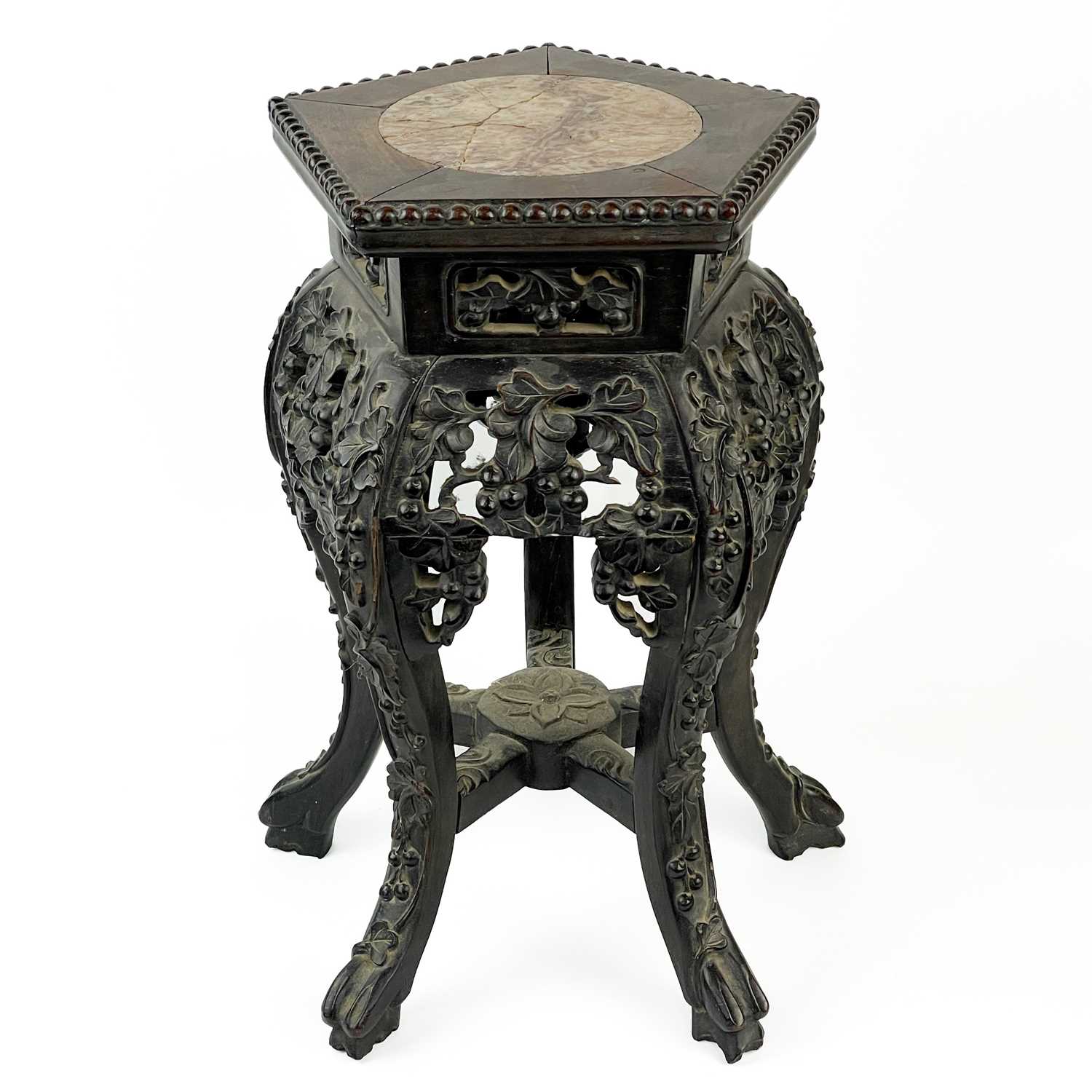 Lot 164 - A Chinese carved hardwood jardiniere stand, 19th century.