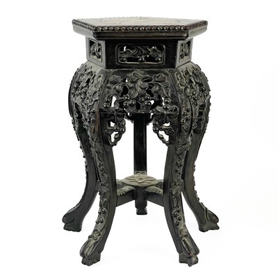 Lot 164 - A Chinese carved hardwood jardiniere stand, 19th century.