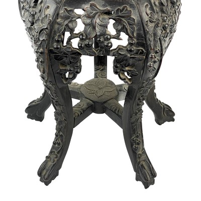 Lot 164 - A Chinese carved hardwood jardiniere stand, 19th century.