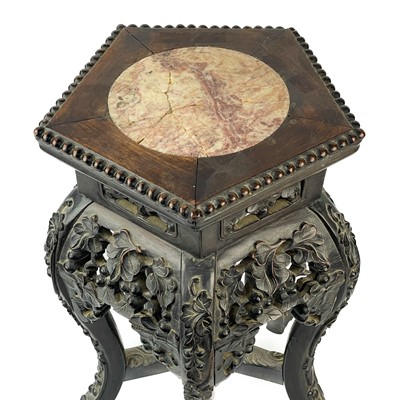 Lot 164 - A Chinese carved hardwood jardiniere stand, 19th century.