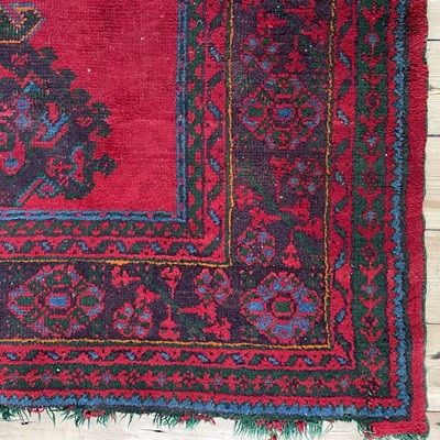 Lot 14 - An Ushak 'Turkey Red' carpet, West Anatolia, circa 1900.