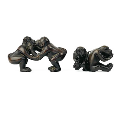 Lot 353 - A Japanese carved wood netsuke of two monkeys.