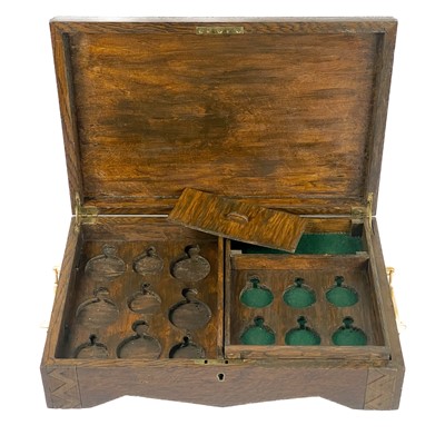 Lot 105 - An oak hinge-lidded pocket watch storage box.