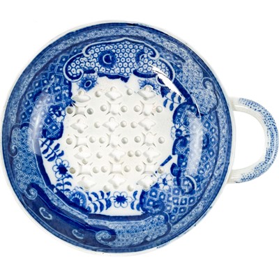 Lot 577 - A blue printed pearlware egg drainer.