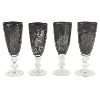 Lot 282 - Four Isle of Wight hand blown black glass goblets.