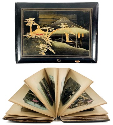 Lot 124 - A black lacquer concertina album of fifty Chinese, Japanese and Hong Kong postcards.