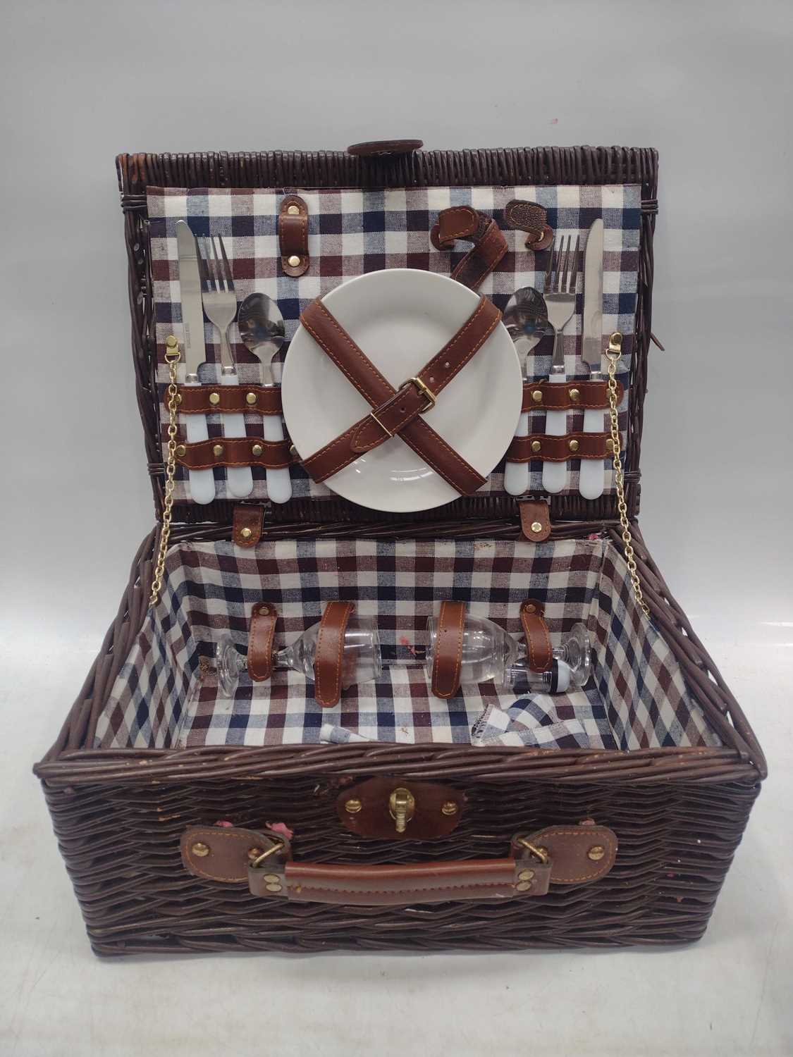 Lot 150 A wicker picnic hamper with cutlery and