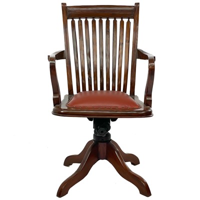 Lot 603 - A teak swivel office chair.