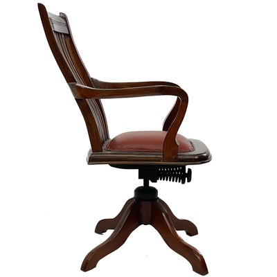 Lot 603 - A teak swivel office chair.