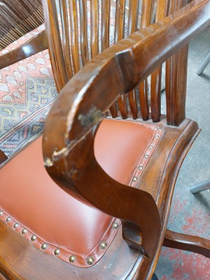 Lot 603 - A teak swivel office chair.