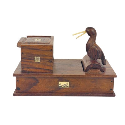 Lot 283 - A Japanese novelty wood cigarette dispenser, 20th century.
