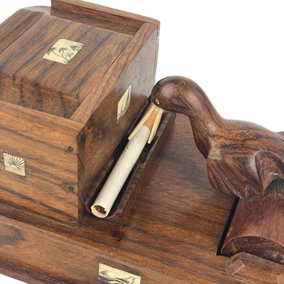 Lot 283 - A Japanese novelty wood cigarette dispenser, 20th century.