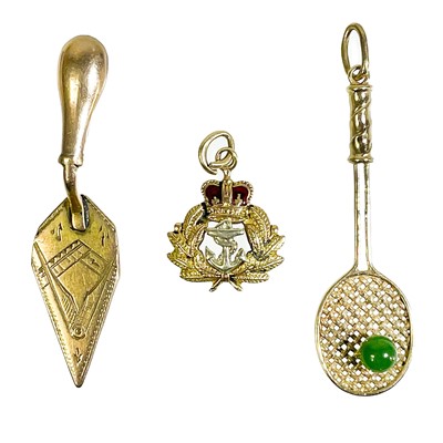 Lot 7 - Three gold charms.