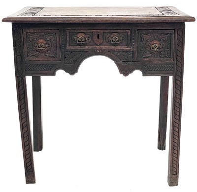 Lot 695 - A late Victorian carved oak side table.