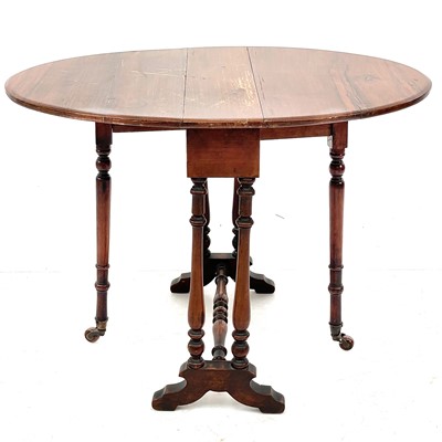 Lot 692 - A late Victorian small oval walnut drop leaf Sutherland table.