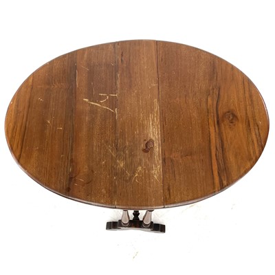 Lot 692 - A late Victorian small oval walnut drop leaf Sutherland table.