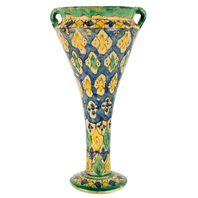 Lot 101 - A Moroccan pottery twin handled vase, 19th century.