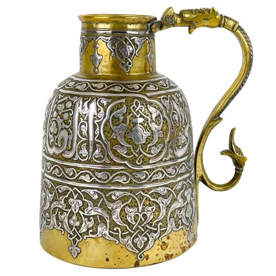 Lot 102 - A Syrian brass and silver jug, 19th century.