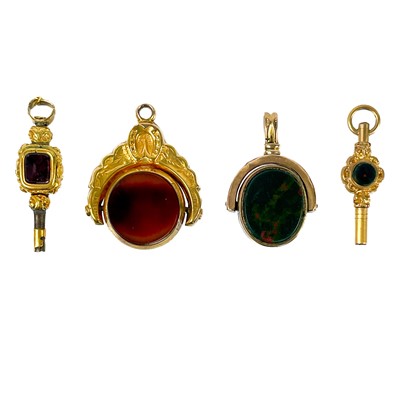 Lot 82 - Two 9ct mounted stone set swivel fobs and two watch winding keys.