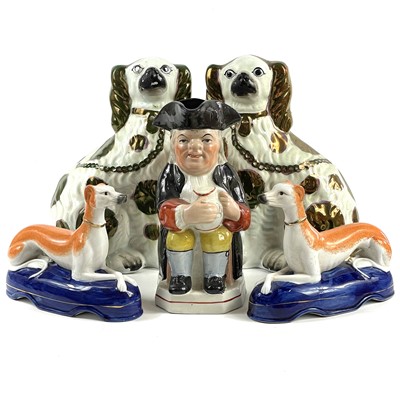 Lot 151 - A pair of late Victorian Staffordshire figures of Spaniels.