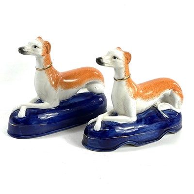 Lot 151 - A pair of late Victorian Staffordshire figures of Spaniels.