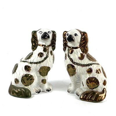 Lot 151 - A pair of late Victorian Staffordshire figures of Spaniels.