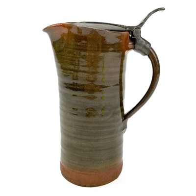 Lot 417 - A Leach Pottery an early red clay jug with a hinged pewter lid.