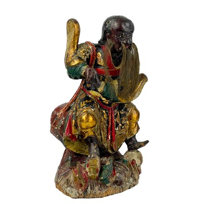Lot 119 - A Chinese carved giltwood and painted figure of Fa Zhu Gong, 19th century.