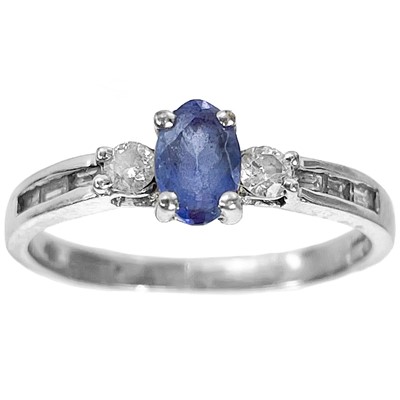 Lot 21 - A modern 14ct white gold diamond and pale blue sapphire set ring.