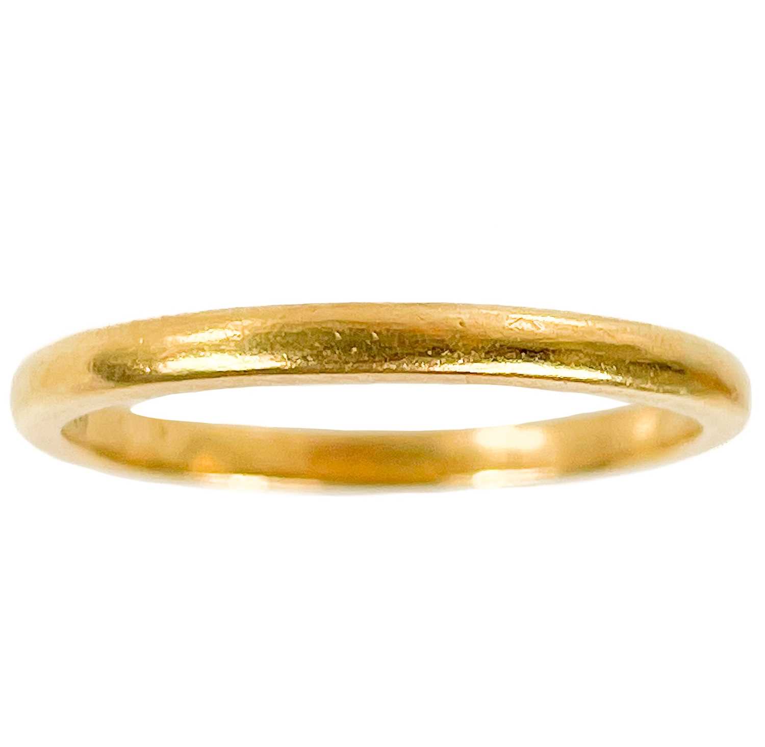 Lot 22 - A 22ct hallmarked gold band ring.