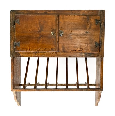 Lot 53 - A Continental pine wall cupboard and rack.