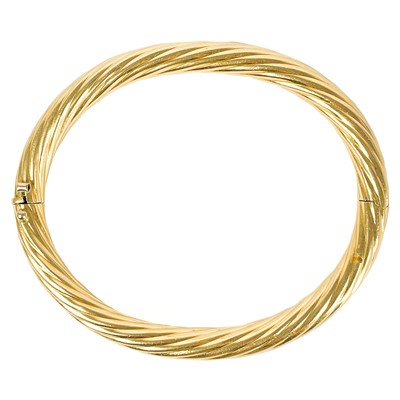 Lot 50 - An 18ct gold Italian hinged hollow twist bangle.