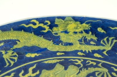 Lot 120 - A Chinese porcelain dragon dish, Qianlong mark and period.