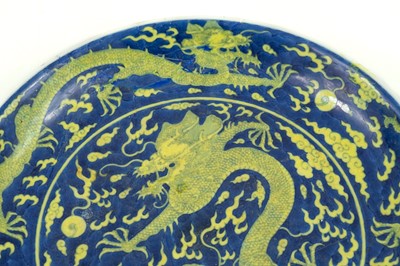 Lot 120 - A Chinese porcelain dragon dish, Qianlong mark and period.