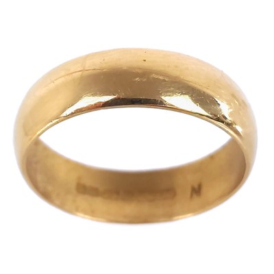 Lot 59 - A 22ct hallmarked gold band ring.