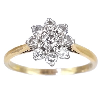 Lot 60 - A modern 18ct gold diamond set nine stone cluster ring.