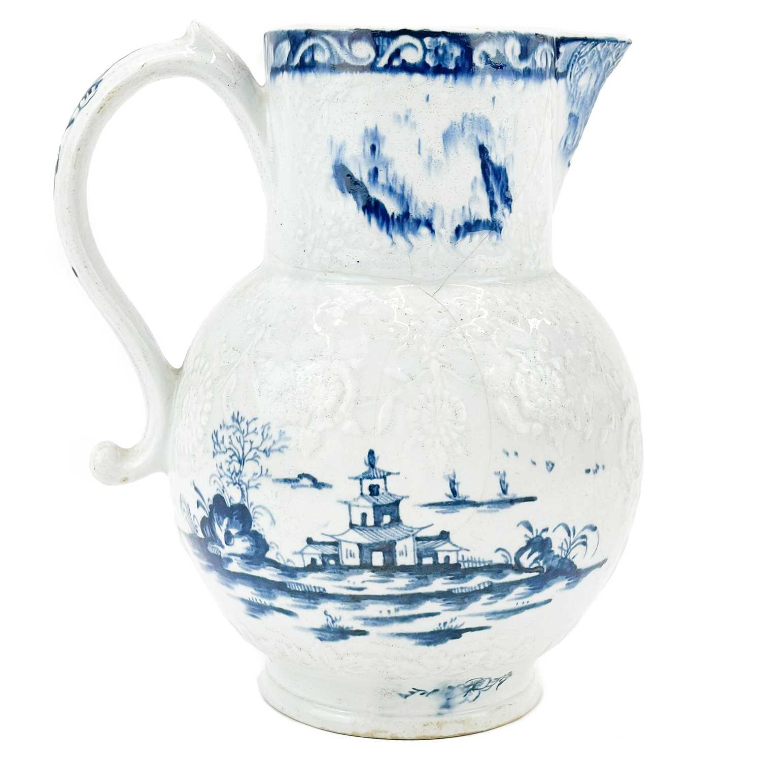 Lot 431 - A large Lowestoft blue and white floral moulded jug.