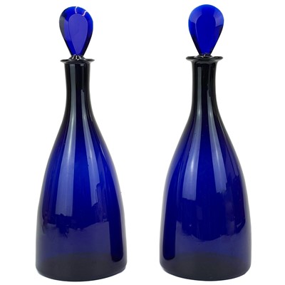 Lot 459 - A pair of George III Bristol blue glass Indian Club form decanters.